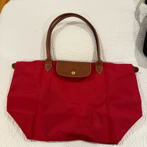 Longchamp Handbags - Red Longchamp Le Pliage Medium with Long Handles